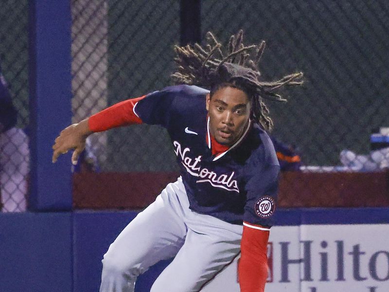 Mar 18, 2024; West Palm Beach, Florida, USA;  Washington Nationals left fielder James Wood fields a ball during the ninth inning against the Houston Astros at The Ballpark of the Palm Beaches. Mandatory Credit: Reinhold Matay-USA TODAY Sports