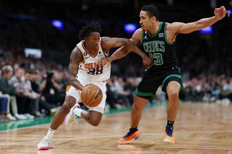 BOSTON, MASSACHUSETTS - FEBRUARY 03: Saben Lee #38 of the Phoenix Suns drives to the basket against Malcolm Brogdon #13 of the Boston Celtics at TD Garden on February 03, 2023 in Boston, Massachusetts. NOTE TO USER: User expressly acknowledges and agrees that, by downloading and or using this photograph, User is consenting to the terms and conditions of the Getty Images License Agreement. (Photo by Maddie Meyer/Getty Images)