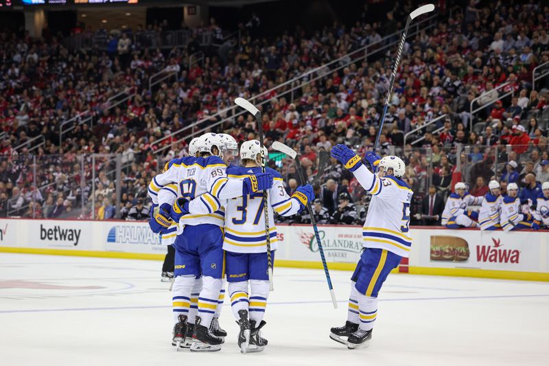 Oct 27, 2023; Newark, New Jersey, USA; Buffalo Sabres defenseman Rasmus Dahlin (26) celebrates his goal with teammates during the second period against the New Jersey Devils at Prudential Center. Mandatory Credit: Vincent Carchietta-USA TODAY Sports