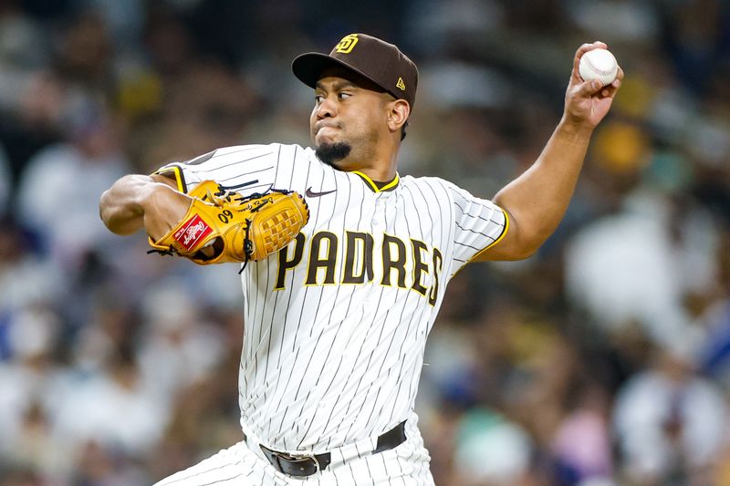 Jun 9, 2025; San Diego, California, USA; San Diego Padres relief pitcher Wandy Peralta (58) throws a pitch during the tenth inning against the Los Angeles Dodgers at Petco Park. Mandatory Credit: David Frerker-Imagn Images