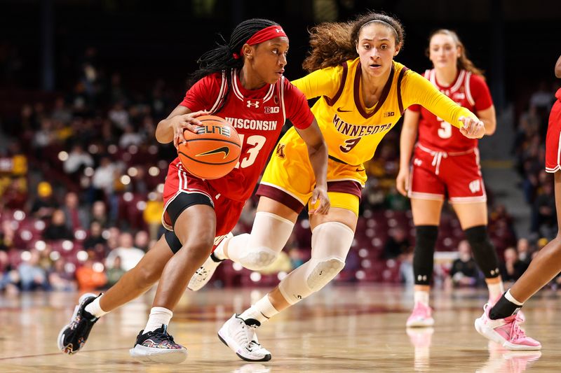 Feb 20, 2024; Minneapolis, Minnesota, USA; Wisconsin Badgers guard Ronnie Porter (13) works around Minnesota Golden Gophers guard Amaya Battle (3) during the second half at Williams Arena. Mandatory Credit: Matt Krohn-USA TODAY Sports