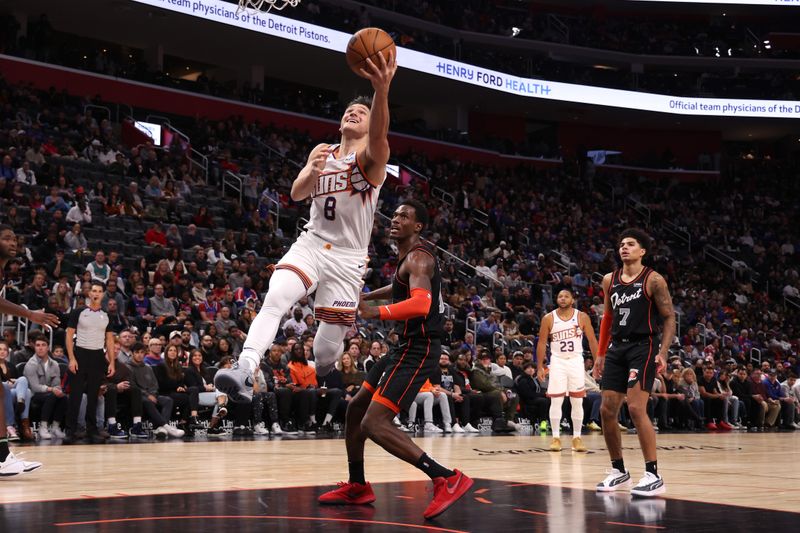 DETROIT, MICHIGAN - NOVEMBER 05: Grayson Allen #8 of the Phoenix Suns gets a first half shot off around Jalen Duren #0 of the Detroit Pistons at Little Caesars Arena on November 05, 2023 in Detroit, Michigan. NOTE TO USER: User expressly acknowledges and agrees that, by downloading and or using this photograph, User is consenting to the terms and conditions of the Getty Images License Agreement. (Photo by Gregory Shamus/Getty Images)