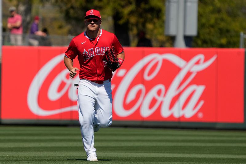 Mar 22, 2024; Tempe, Arizona, USA; Los Angeles Angels center fielder Mike Trout (27) runs in from the outfield in the third inning against the Chicago White Sox at Tempe Diablo Stadium. Mandatory Credit: Rick Scuteri-USA TODAY Sports