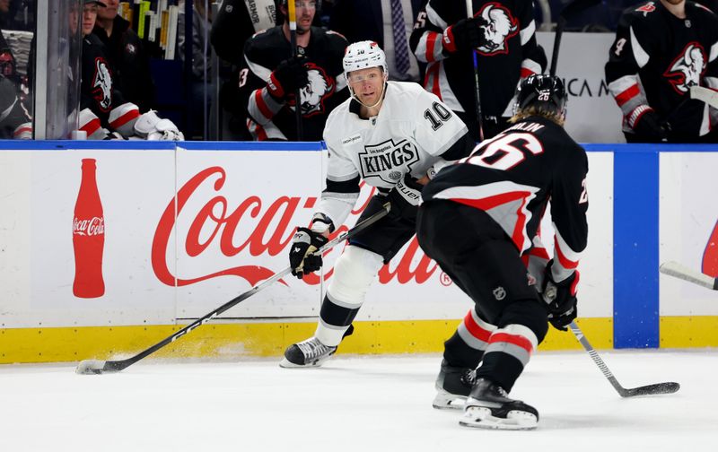 Jan 29, 2026; Buffalo, New York, USA;  Buffalo Sabres defenseman Rasmus Dahlin (26) defends as Los Angeles Kings right wing Corey Perry (10) looks to make a pass during the first period at KeyBank Center. Mandatory Credit: Timothy T. Ludwig-Imagn Images