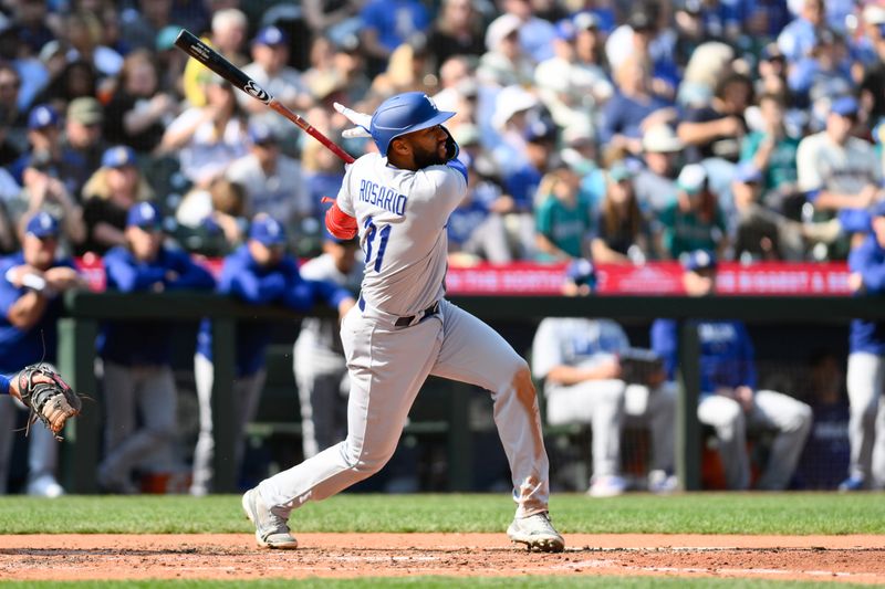 Sep 17, 2023; Seattle, Washington, USA; Los Angeles Dodgers shortstop Amed Rosario (31) hits a single against the Seattle Mariners during the sixth inning at T-Mobile Park. Mandatory Credit: Steven Bisig-USA TODAY Sports