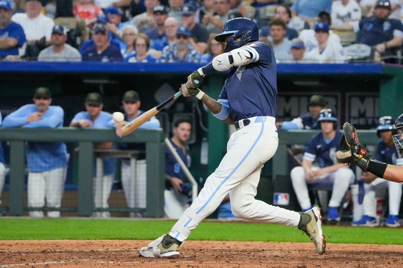 May 17, 2024; Kansas City, Missouri, USA; Kansas City Royals third baseman Maikel Garcia (11) hits a three-run home run against the Oakland Athletics in the sixth inning at Kauffman Stadium. Mandatory Credit: Denny Medley-USA TODAY Sports