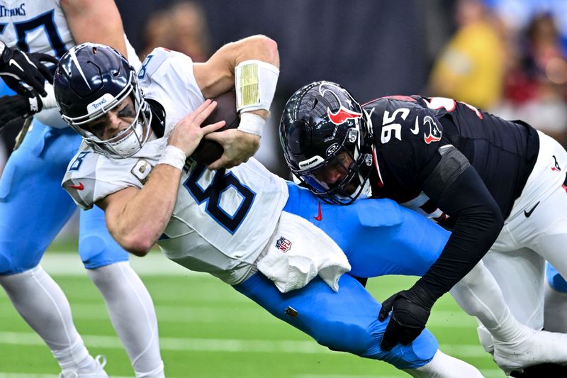 Houston Texans defensive end Derek Barnett (95) tackles Tennessee Titans quarterback Will Levis (8) during the second quarter during an NFL football game, Sunday, Nov 24, 2024 in Houston. (AP Photo/Maria Lysaker)