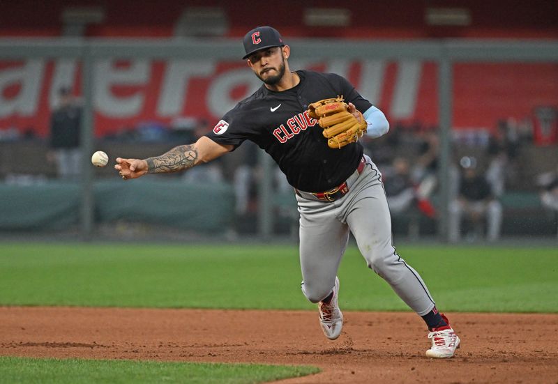 Jun 27, 2024; Kansas City, Missouri, USA; Cleveland Guardians shortstop Gabriel Arias (13) throws the ball to first base for an out in the fourth inning against the Kansas City Royals at Kauffman Stadium. Mandatory Credit: Peter Aiken-USA TODAY Sports