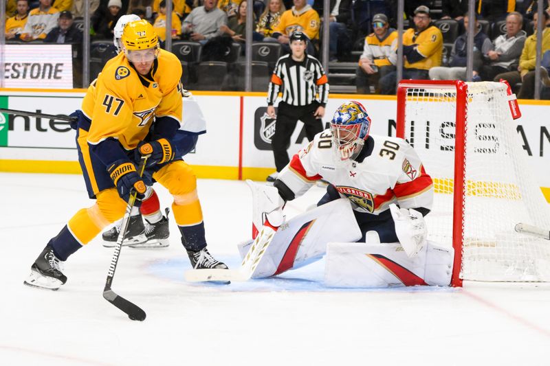 Feb 25, 2025; Nashville, Tennessee, USA;  Nashville Predators right wing Michael McCarron (47) skates with the puck and scores past Florida Panthers goaltender Spencer Knight (30) during the third half at Bridgestone Arena. Mandatory Credit: Steve Roberts-Imagn Images