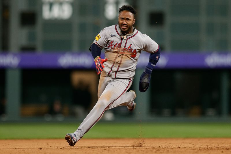 Apr 28, 2025; Denver, Colorado, USA; Atlanta Braves second baseman Ozzie Albies (1) rounds second as he runs home on an RBI in the fifth inning against the Colorado Rockies at Coors Field. Mandatory Credit: Isaiah J. Downing-Imagn Images