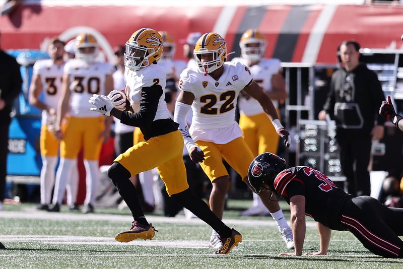 Nov 4, 2023; Salt Lake City, Utah, USA; Arizona State Sun Devils wide receiver Elijhah Badger (2) breaks a tackled by Utah Utes place kicker Cole Becker (36) in the first quarter at Rice-Eccles Stadium. Mandatory Credit: Rob Gray-USA TODAY Sports