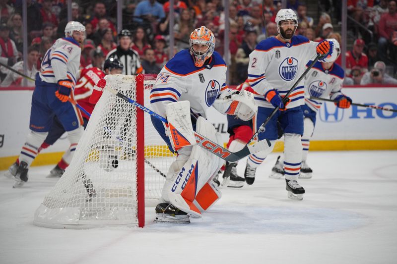 Jun 24, 2024; Sunrise, Florida, USA; Edmonton Oilers goaltender Skinner Stuart (74) watches the puck behind the net during the second period against the Florida Panthers in game seven of the 2024 Stanley Cup Final at Amerant Bank Arena. Mandatory Credit: Jim Rassol-USA TODAY Sports