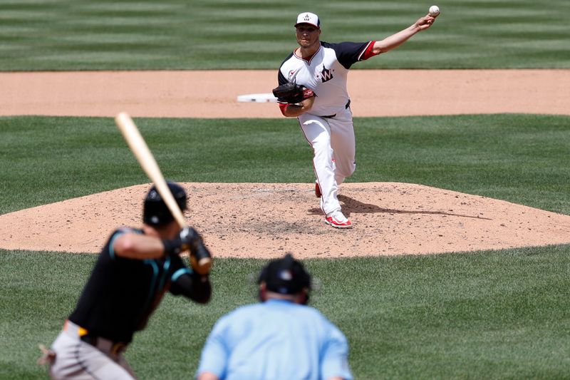 Jun 20, 2024; Washington, District of Columbia, USA; Washington Nationals relief pitcher Robert Garcia (61) pitches against Arizona Diamondbacks shortstop Blaze Alexander (9) during the seventh inning at Nationals Park. Mandatory Credit: Geoff Burke-USA TODAY Sports