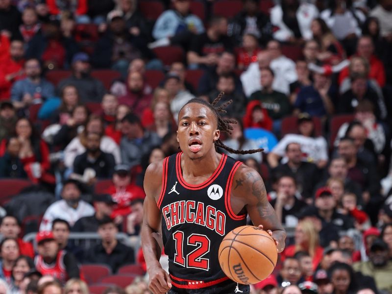 CHICAGO, IL - MARCH 25:  Ayo Dosunmu #12 of the Chicago Bulls dribbles the ball during the game against the Washington Wizards on March 25, 2024 at United Center in Chicago, Illinois. NOTE TO USER: User expressly acknowledges and agrees that, by downloading and or using this photograph, User is consenting to the terms and conditions of the Getty Images License Agreement. Mandatory Copyright Notice: Copyright 2024 NBAE (Photo by Jeff Haynes/NBAE via Getty Images)