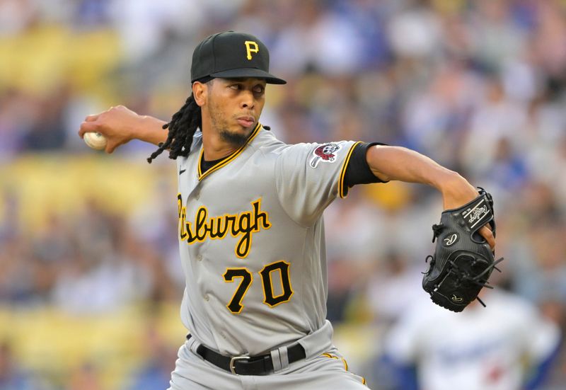 Jul 5, 2023; Los Angeles, California, USA; Pittsburgh Pirates starting pitcher Osvaldo Bido (70) throws to the plate in the first inning against the Los Angeles Dodgers at Dodger Stadium. Mandatory Credit: Jayne Kamin-Oncea-USA TODAY Sports