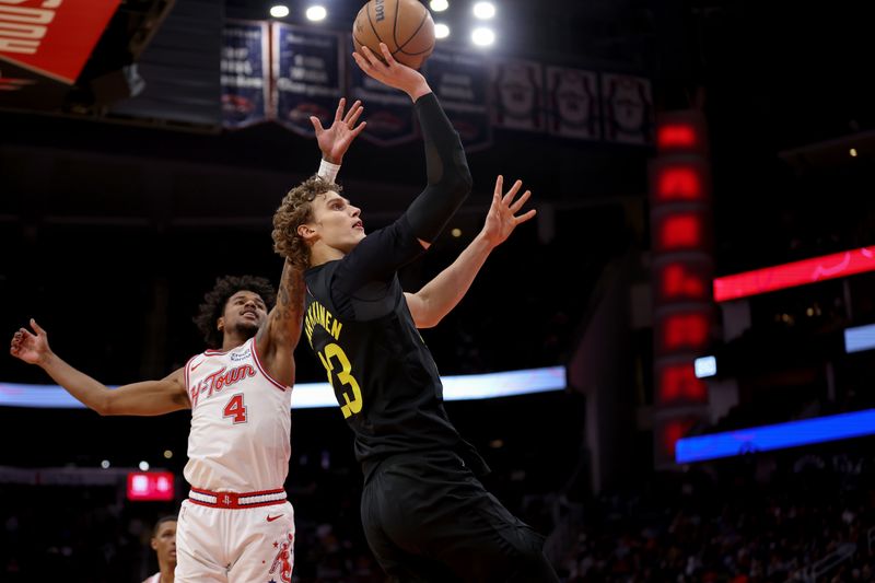 HOUSTON, TEXAS - JANUARY 20: Lauri Markkanen #23 of the Utah Jazz shoots the ball while defended by Jalen Green #4 of the Houston Rockets in overtime at Toyota Center on January 20, 2024 in Houston, Texas.  NOTE TO USER: User expressly acknowledges and agrees that, by downloading and or using this photograph, User is consenting to the terms and conditions of the Getty Images License Agreement. (Photo by Tim Warner/Getty Images)