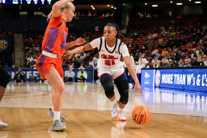 Mar 8, 2024; Greensville, SC, USA; Ole Miss Rebels guard Zakiya Stephenson (21) drives to the basket against 
Florida Gators guard Alberte Rimdal (5) during the first half at Bon Secours Wellness Arena. Mandatory Credit: Jim Dedmon-USA TODAY Sports