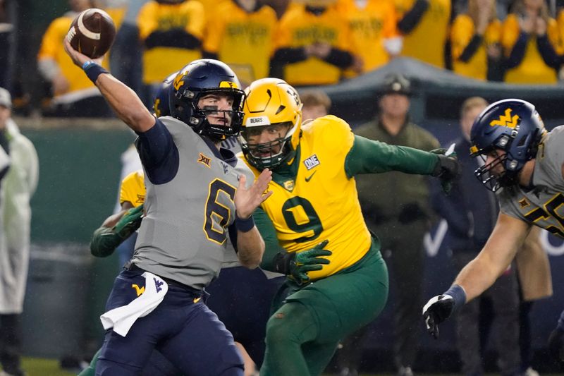 Nov 25, 2023; Waco, Texas, USA; West Virginia Mountaineers quarterback Garrett Greene (6) throws downfield against the Baylor Bears during the first half at McLane Stadium. Mandatory Credit: Raymond Carlin III-USA TODAY Sports