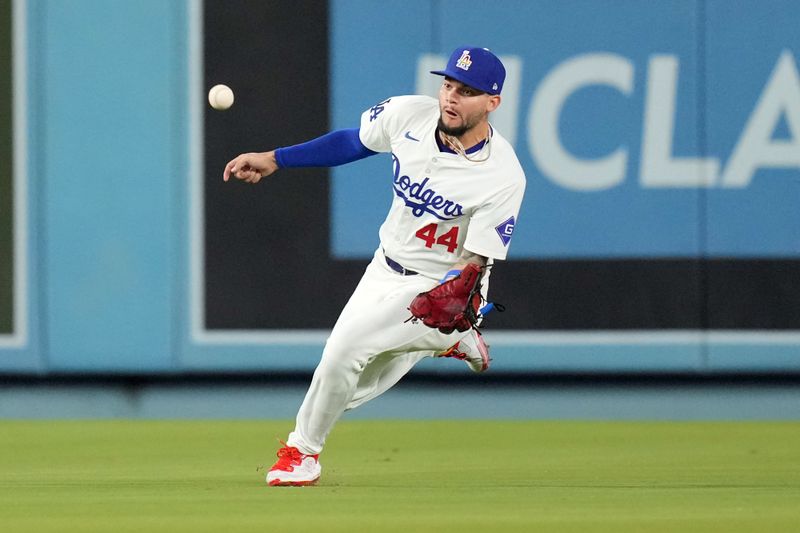 Jun 14, 2024; Los Angeles, California, USA; Los Angeles Dodgers center fielder Andy Pages (44) catches the ball in the seventh inning against the Kansas City Royals at Dodger Stadium. Mandatory Credit: Kirby Lee-USA TODAY Sports