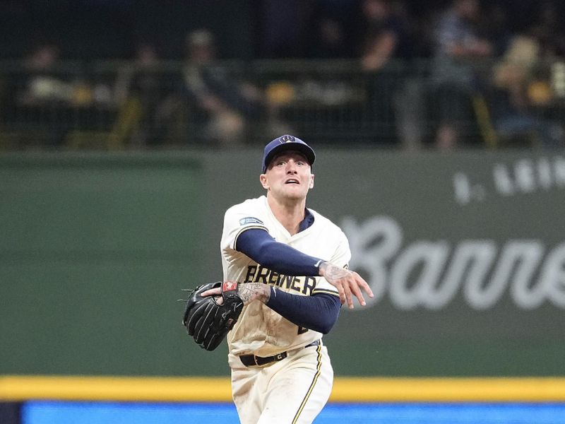 Jul 10, 2024; Milwaukee, Wisconsin, USA;  Milwaukee Brewers second baseman Brice Turang (2) throws to first base during the eighth inning against the Pittsburgh Pirates at American Family Field. Mandatory Credit: Jeff Hanisch-USA TODAY Sports