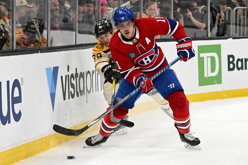 Jan 20, 2024; Boston, Massachusetts, USA; Montreal Canadiens right wing Brendan Gallagher (11) controls the puck against Boston Bruins center Morgan Geekie (39) during the first period at the TD Garden. Mandatory Credit: Brian Fluharty-USA TODAY Sports