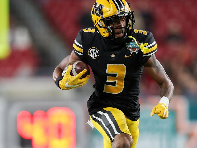 Dec 23, 2022; Tampa, Florida, USA; Missouri Tigers wide receiver Luther Burden III (3) runs with the ball against the Wake Forest Demon Deacons in the first quarter in the 2022 Gasparilla Bowl at Raymond James Stadium. Mandatory Credit: Nathan Ray Seebeck-USA TODAY Sports