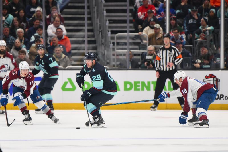 Dec 16, 2025; Seattle, Washington, USA; Seattle Kraken defenseman Vince Dunn (29) plays the puck during the third period against the Colorado Avalanche at Climate Pledge Arena. Mandatory Credit: Steven Bisig-Imagn Images