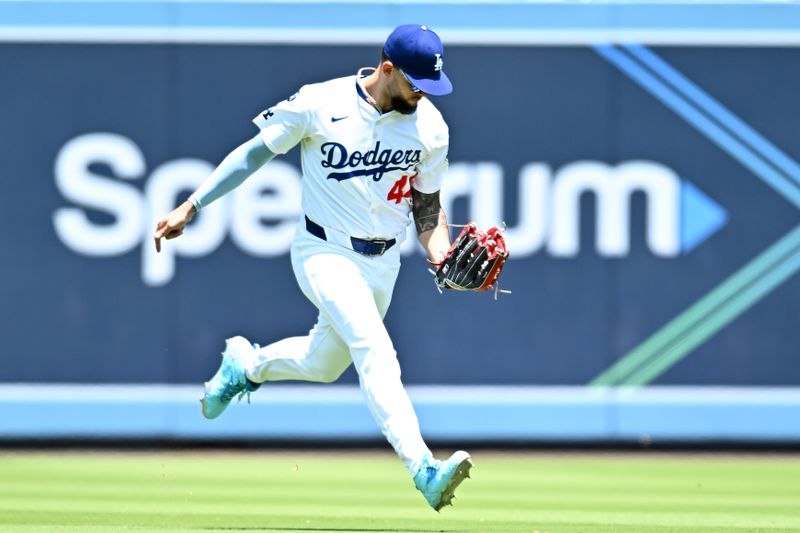 Jul 20, 2025; Los Angeles, California, USA; Los Angeles Dodgers center fielder Andy Pages (44) makes a catch against the Milwaukee Brewers during the second inning of the game at Dodger Stadium. Mandatory Credit: Jonathan Hui-Imagn Images