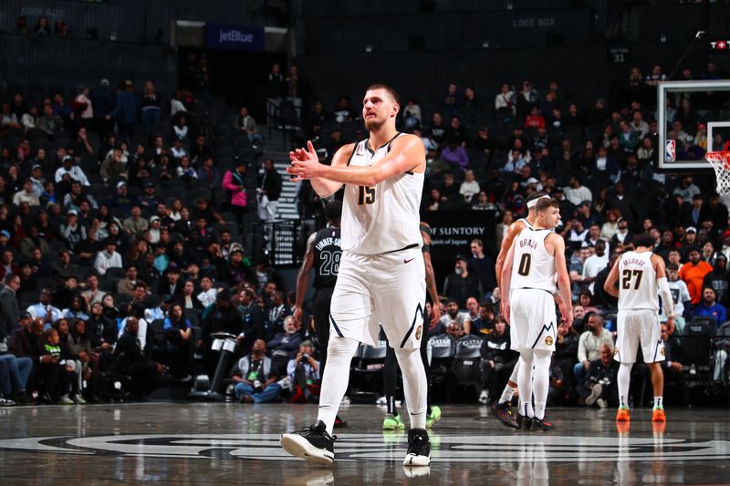 BROOKLYN, NY - OCTOBER 29: Nikola Jokic #15 of the Denver Nuggets looks on during the game against the Brooklyn Nets on October 29, 2024 at Barclays Center in Brooklyn, New York. NOTE TO USER: User expressly acknowledges and agrees that, by downloading and or using this Photograph, user is consenting to the terms and conditions of the Getty Images License Agreement. Mandatory Copyright Notice: Copyright 2024 NBAE (Photo by David L. Nemec/NBAE via Getty Images)