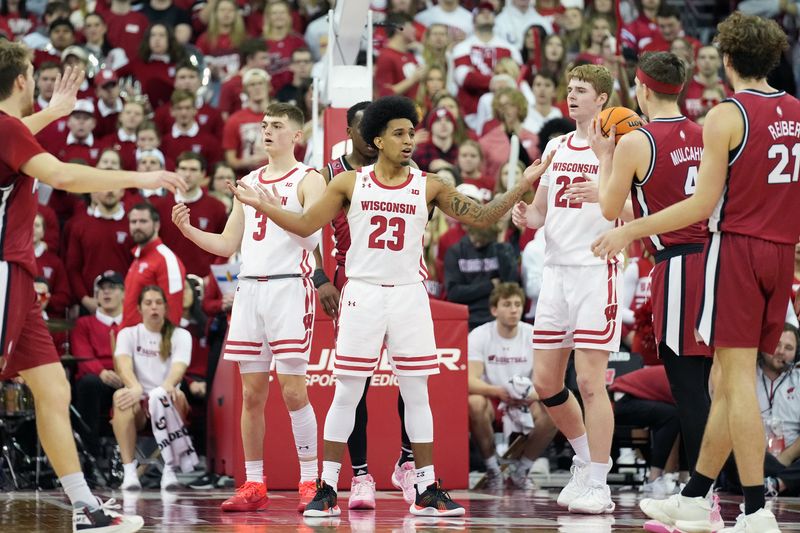 Feb 18, 2023; Madison, Wisconsin, USA;  Wisconsin Badgers guard Chucky Hepburn (23) reacts to his fourth foul during the second half against the Rutgers Scarlet Knights at the Kohl Center. Mandatory Credit: Kayla Wolf-USA TODAY Sports