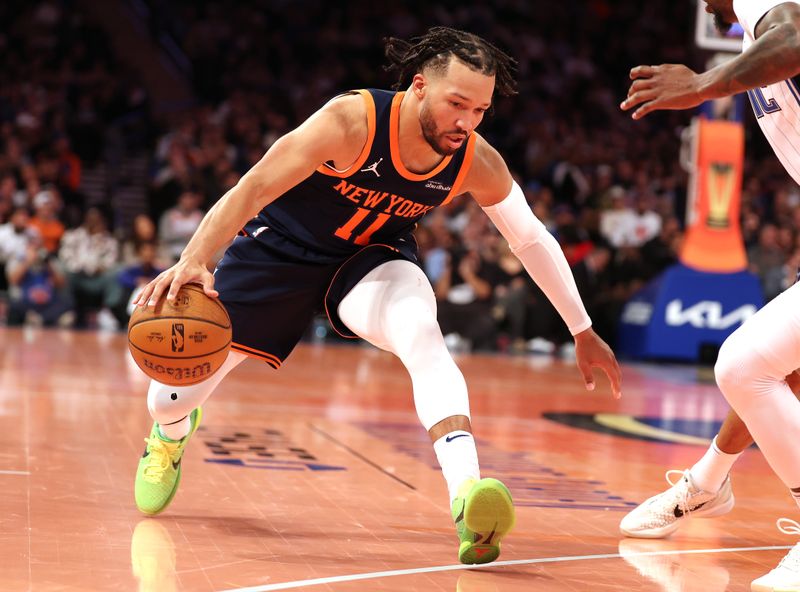 NEW YORK, NEW YORK - DECEMBER 03:  Jalen Brunson #11 of the New York Knicks dribbles against the Orlando Magic during their game at Madison Square Garden on December 03, 2024 in New York City.   User expressly acknowledges and agrees that, by downloading and or using this photograph, User is consenting to the terms and conditions of the Getty Images License Agreement.  (Photo by Al Bello/Getty Images)