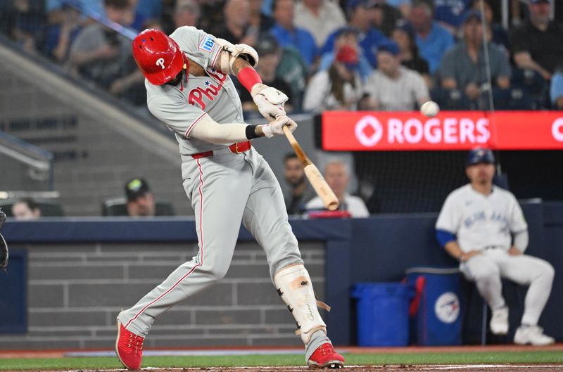 Jun 4, 2025; Toronto, Ontario, CAN;  Philadelphia Phillies right fielder Nick Castellanos (8) hits a solo home run against the Toronto Blue Jays in the second inning at Rogers Centre. Mandatory Credit: Dan Hamilton-Imagn Images