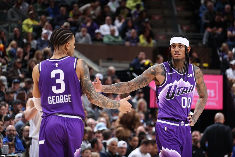 SALT LAKE CITY, UT - MARCH 25: Jordan Clarkson #00 high fives Keyonte George #3 of the Utah Jazz during the game against the Dallas Mavericks on March 25, 2024 at Delta Center in Salt Lake City, Utah. NOTE TO USER: User expressly acknowledges and agrees that, by downloading and or using this Photograph, User is consenting to the terms and conditions of the Getty Images License Agreement. Mandatory Copyright Notice: Copyright 2024 NBAE (Photo by Melissa Majchrzak/NBAE via Getty Images)