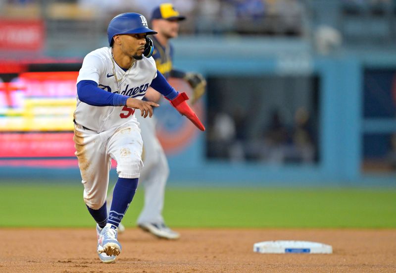 Aug 17, 2023; Los Angeles, California, USA;  Los Angeles Dodgers right fielder Mookie Betts (50) takes a lead off second base in the first inning against the Milwaukee Brewers at Dodger Stadium. Mandatory Credit: Jayne Kamin-Oncea-USA TODAY Sports