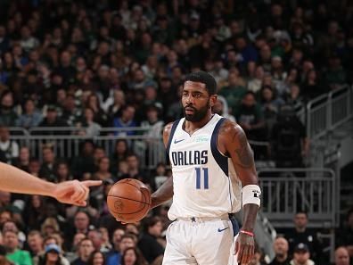 MILWAUKEE, WI - NOVEMBER 18: Kyrie Irving #11 of the Dallas Mavericks dribbles the ball during the game against the Milwaukee Bucks on November 18, 2023 at the Fiserv Forum Center in Milwaukee, Wisconsin. NOTE TO USER: User expressly acknowledges and agrees that, by downloading and or using this Photograph, user is consenting to the terms and conditions of the Getty Images License Agreement. Mandatory Copyright Notice: Copyright 2023 NBAE (Photo by Gary Dineen/NBAE via Getty Images).