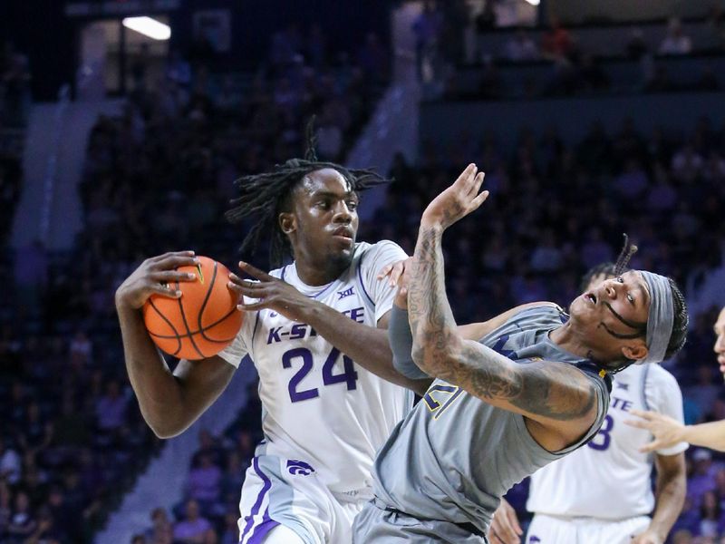 Feb 26, 2024; Manhattan, Kansas, USA; West Virginia Mountaineers guard RaeQuan Battle (21) takes a charge from Kansas State Wildcats forward Arthur Maluma (24) during the first half at Bramlage Coliseum. Mandatory Credit: Scott Sewell-USA TODAY Sports