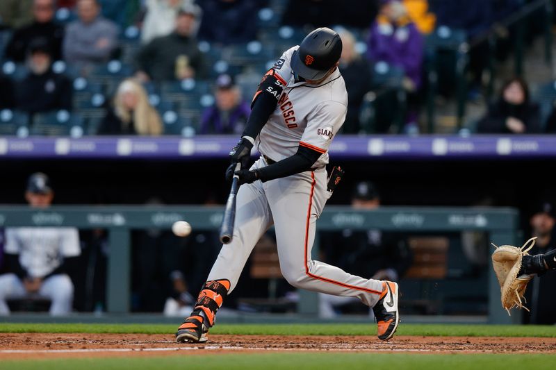 May 7, 2024; Denver, Colorado, USA; San Francisco Giants catcher Blake Sabol (21) hits a single in the fourth inning against the Colorado Rockies at Coors Field. Mandatory Credit: Isaiah J. Downing-USA TODAY Sports