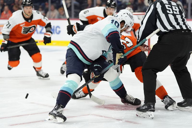 Oct 20, 2025; Philadelphia, Pennsylvania, USA; Seattle Kraken center Matty Beniers (10) wins a faceoff against the Philadelphia Flyers in the first period at Xfinity Mobile Arena. Mandatory Credit: Kyle Ross-Imagn Images