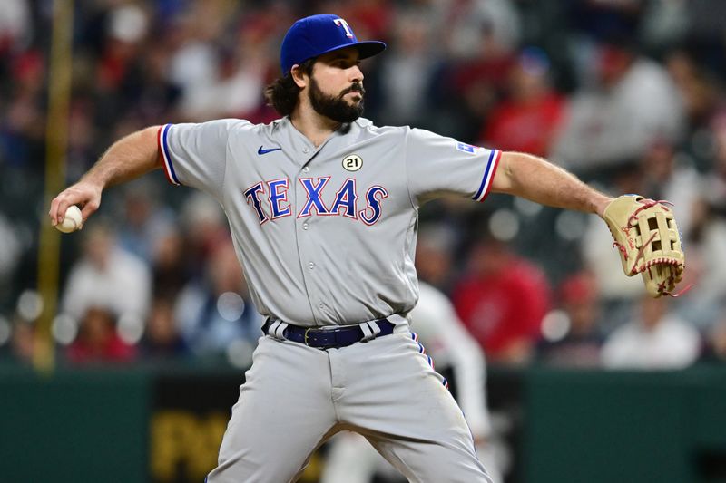 Sep 15, 2023; Cleveland, Ohio, USA; Texas Rangers catcher Austin Hedges (11) throws a pitch during the eighth inning against the Cleveland Guardians at Progressive Field. Mandatory Credit: Ken Blaze-USA TODAY Sports