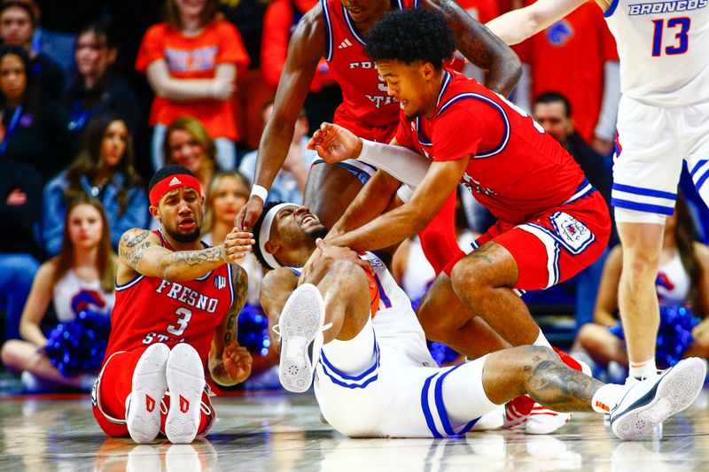 Feb 17, 2024; Boise, Idaho, USA; Boise State Broncos guard Chibuzo Agbo (11) tussles with Fresno State Bulldogs guard Xavier DuSell (53) during the first half at ExtraMile Arena. Mandatory Credit: Brian Losness-USA TODAY Sports


