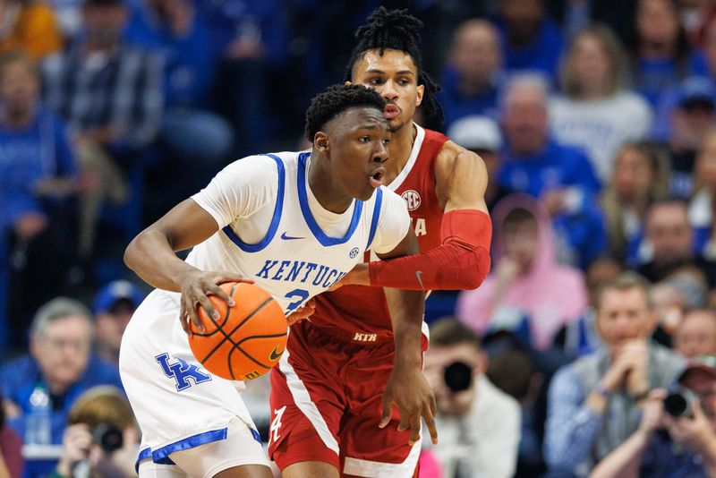 Feb 24, 2024; Lexington, Kentucky, USA; Kentucky Wildcats guard Adou Thiero (3) dribbles around Alabama Crimson Tide forward Jarin Stevenson (15) during the first half at Rupp Arena at Central Bank Center. Mandatory Credit: Jordan Prather-USA TODAY Sports