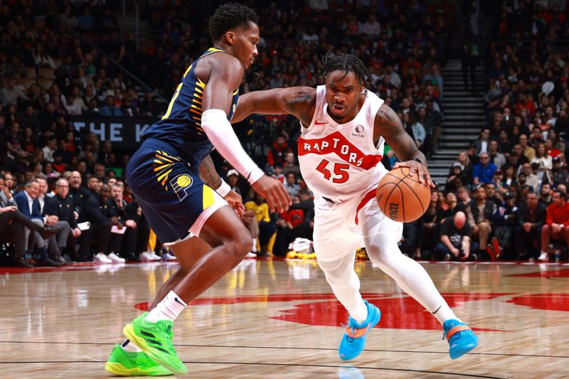 TORONTO, CANADA - NOVEMBER 18: Davion Mitchell #45 of the Toronto Raptors handles the ball during the game against the Indiana Pacers on November 18, 2024 at the Scotiabank Arena in Toronto, Ontario, Canada.  NOTE TO USER: User expressly acknowledges and agrees that, by downloading and or using this Photograph, user is consenting to the terms and conditions of the Getty Images License Agreement.  Mandatory Copyright Notice: Copyright 2024 NBAE (Photo by Vaughn Ridley/NBAE via Getty Images)