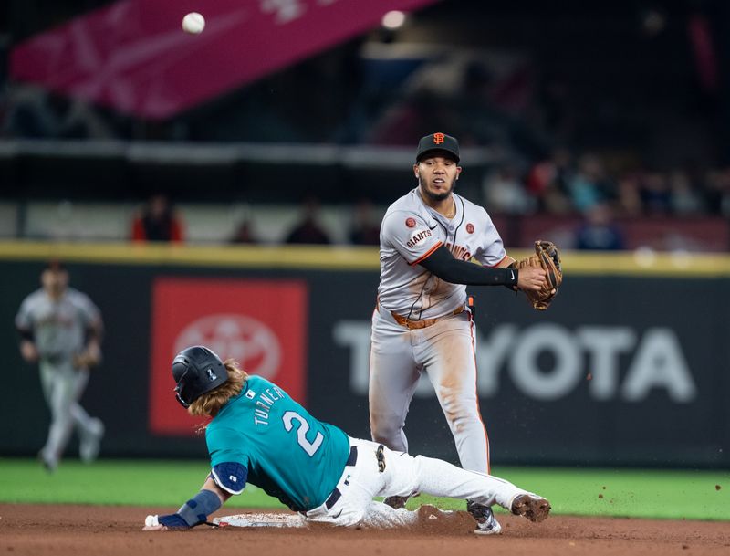 Aug 23, 2024; Seattle, Washington, USA; San Francisco Giants second baseman Thairo Estrada (39) during the seventh inning attempts to turn a double play after forcing out Seattle Mariners first baseman Justin Turner (2) at second base during the seventh inning  at T-Mobile Park. Mandatory Credit: Stephen Brashear-USA TODAY Sports