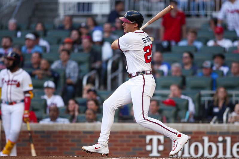 May 12, 2025; Atlanta, Georgia, USA; Atlanta Braves first baseman Matt Olson (28) hits a single against the Washington Nationals in the third inning at Truist Park. Mandatory Credit: Brett Davis-Imagn Images