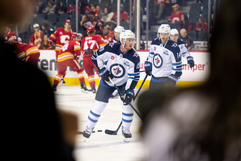 Oct 20, 2025; Calgary, Alberta, CAN; Winnipeg Jets center Jonathan Toews (19) warms up before a game against the Calgary Flames at Scotiabank Saddledome. Mandatory Credit: Brett Holmes-Imagn Images