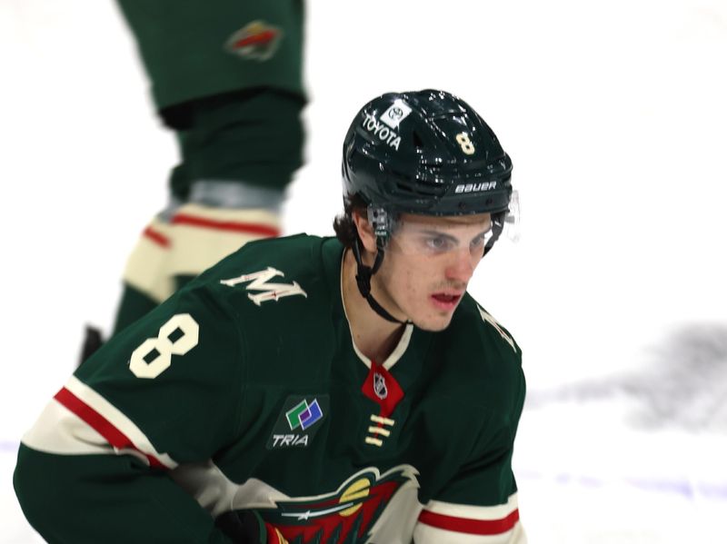 Apr 26, 2025; Saint Paul, Minnesota, USA; Minnesota Wild defenseman Zeev Buium (8) stickhandler prior to the start of game four of the first round of the 2025 Stanley Cup Playoffs at Xcel Energy Center. Mandatory Credit: Bruce Fedyck-Imagn Images