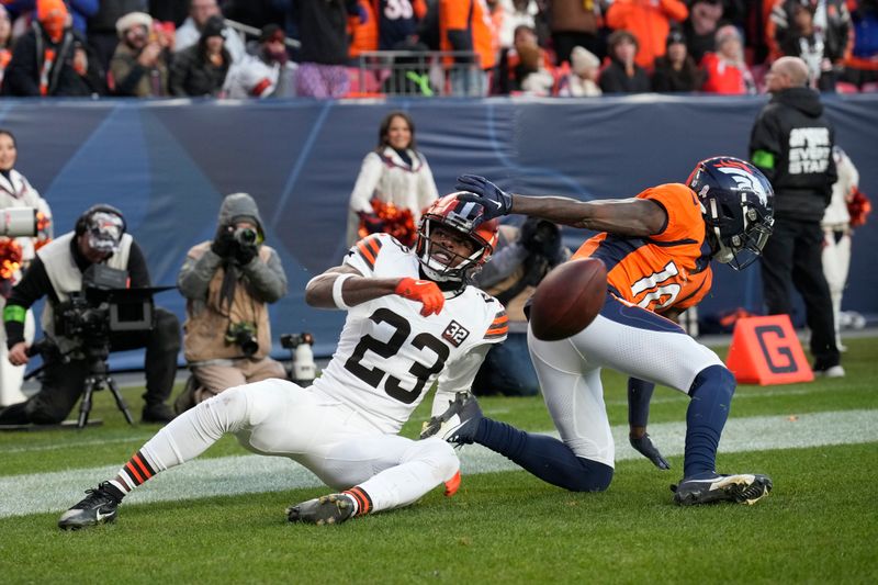 Cleveland Browns cornerback Martin Emerson Jr. (23) breaks up a pass intended for Denver Broncos wide receiver Jerry Jeudy, right, during the second half of an NFL football game on Sunday, Nov. 26, 2023, in Denver. (AP Photo/David Zalubowski)