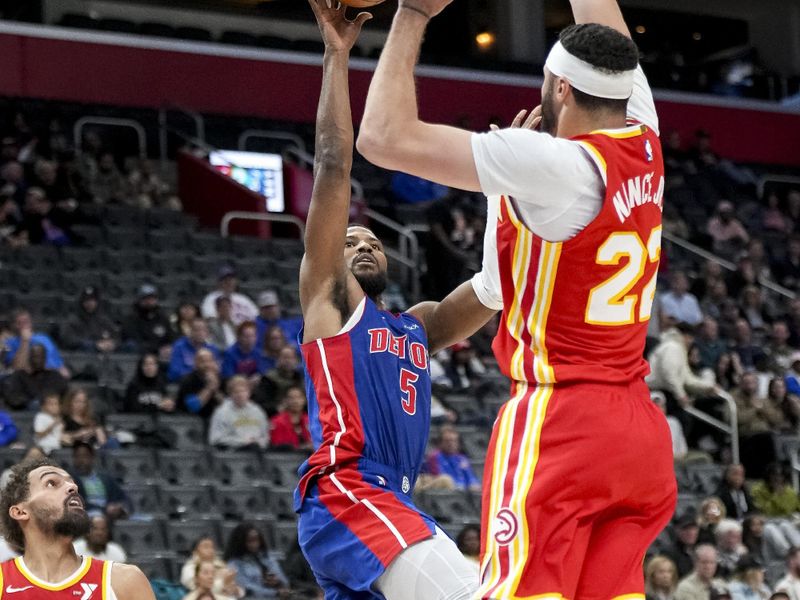 DETROIT, MICHIGAN - NOVEMBER 08: Malik Beasley #5 of the Detroit Pistons shoots the ball against Larry Nance Jr. #22 of the Atlanta Hawks during the fourth quarter at Little Caesars Arena on November 08, 2024 in Detroit, Michigan. NOTE TO USER: User expressly acknowledges and agrees that, by downloading and or using this photograph, User is consenting to the terms and conditions of the Getty Images License Agreement. (Photo by Nic Antaya/Getty Images)