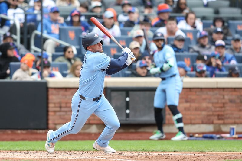 Apr 6, 2025; New York City, New York, USA;  Toronto Blue Jays center fielder Myles Straw (3) hits a single in the third inning against the New York Mets at Citi Field. Mandatory Credit: Wendell Cruz-Imagn Images