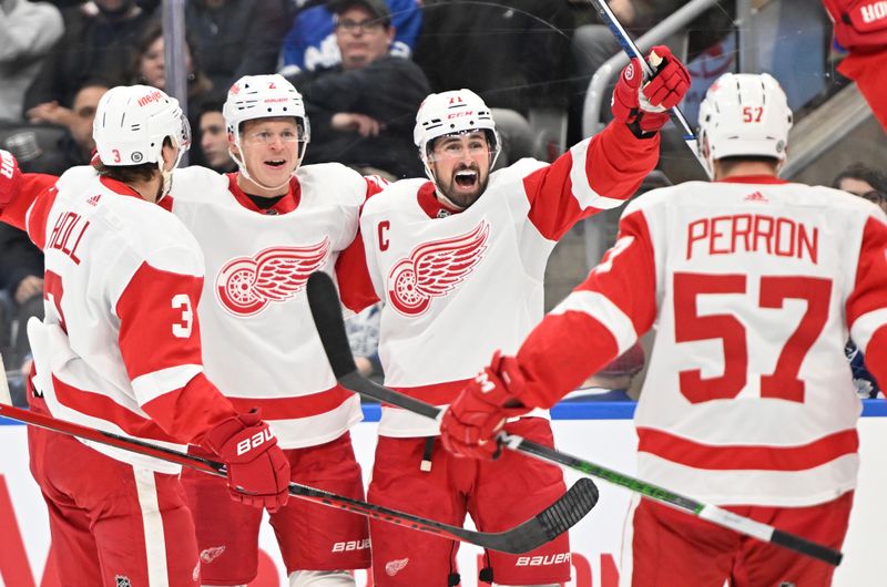 Jan 14, 2024; Toronto, Ontario, CAN;  Detroit Red Wings forward Dylan Larkin (71) celebrates with teammates after scoring against the Toronto Maple Leafs in the second period at Scotiabank Arena. Mandatory Credit: Dan Hamilton-USA TODAY Sports